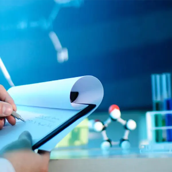 taking notes in lab test tubes chemical elements